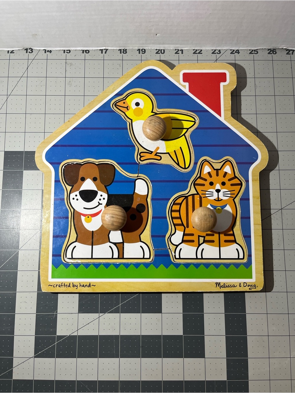 Melissa & Doug Wooden House Peg Puzzle with Blue, Yellow, Brown, Orange